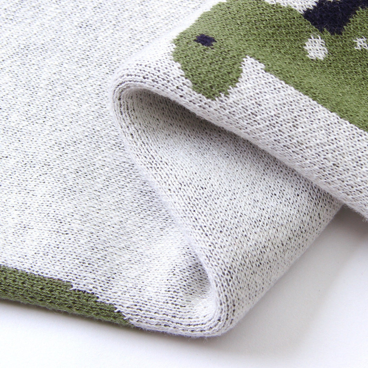 Cosima | Knitted Baby Blanket with Dinosaur Design for Nursery